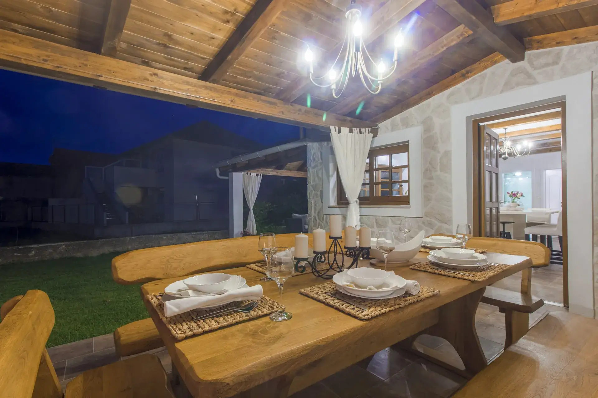 Table set for dinner beside the back door leading into the kitchen
