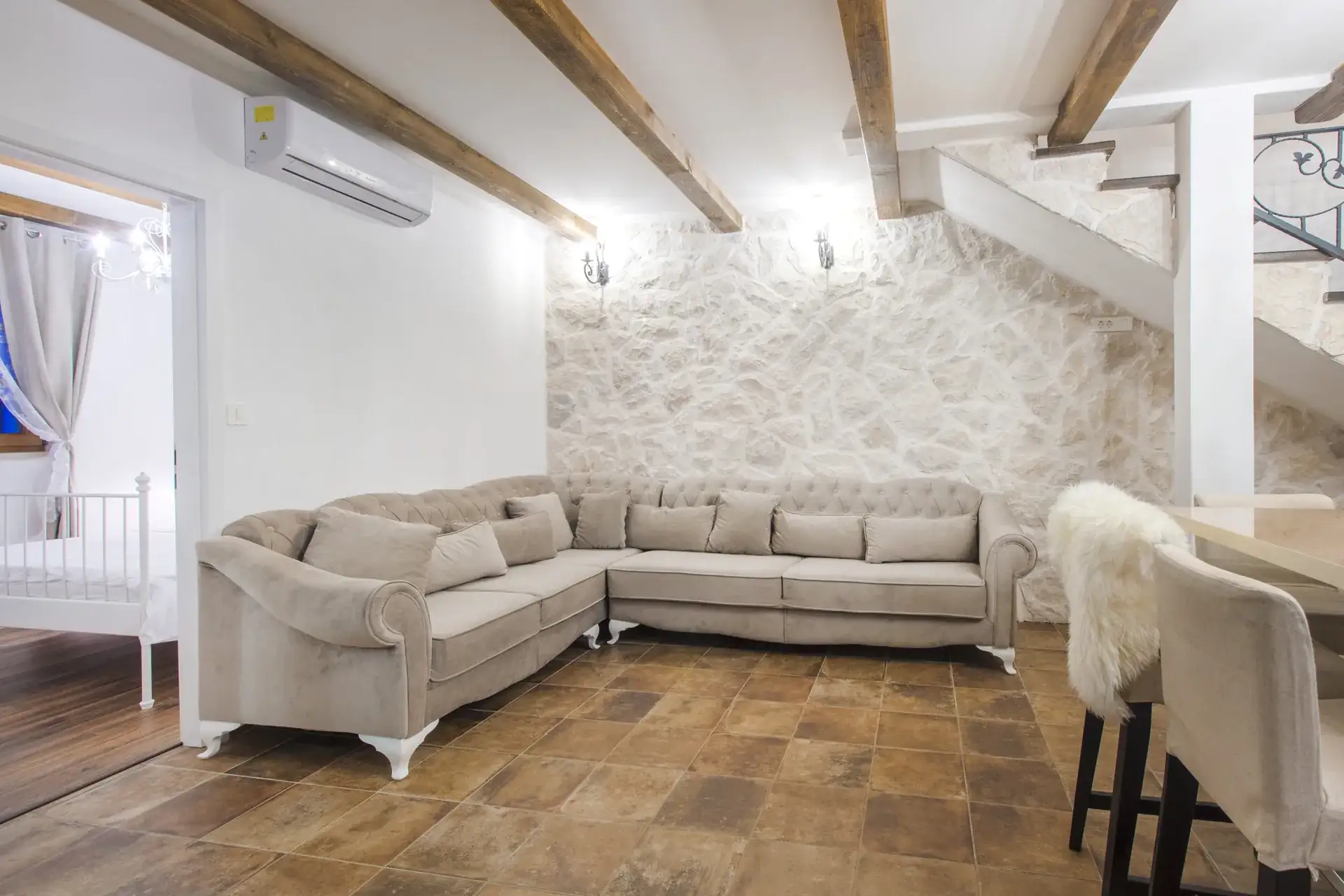 Beige sofa in the living room at House Leila