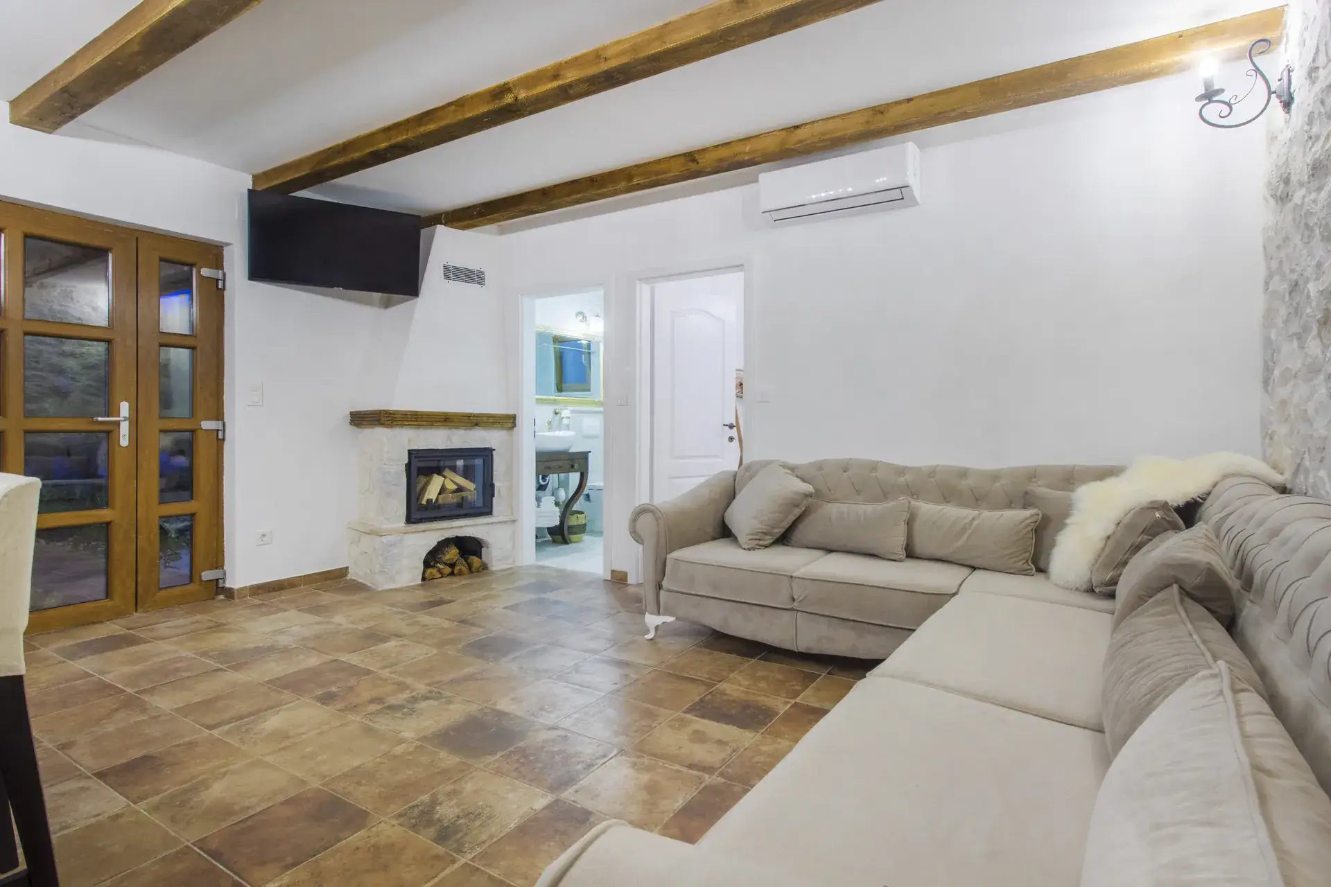 Living room with corner sofa, Smart TV and fireplace